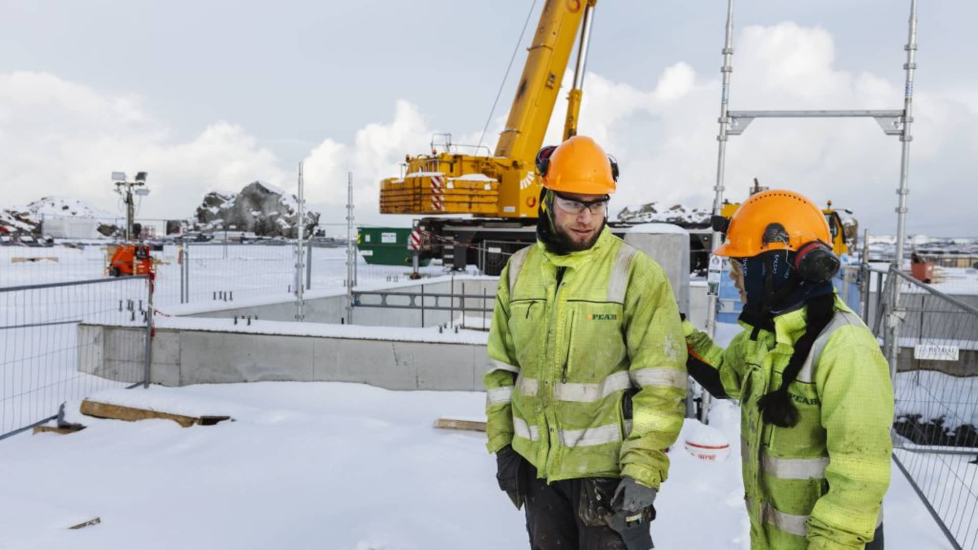 Workers at an entrance to the CO2 pipeline access tunnel at the Northern Lights carbon capture and storage project, controlled by Equinor ASA, Shell Plc and TotalEnergies SE, at Blomoyna, Norway, on Friday, Jan. 19, 2024.