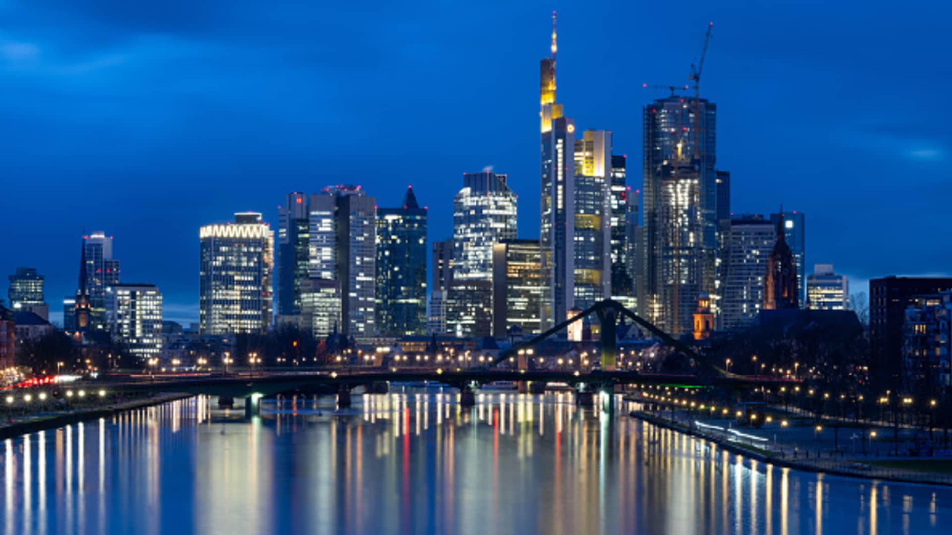 23 February 2024, Hesse, Frankfurt/Main: The lights of Frankfurt am Main's banking skyline glow in the last light of day. Photo: Boris Roessler/dpa (Photo by Boris Roessler/picture alliance via Getty Images)