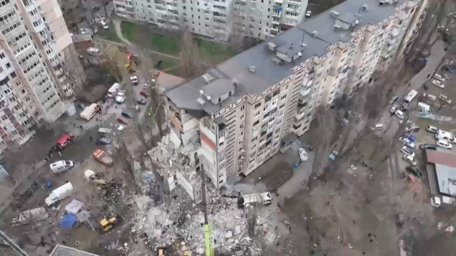 Drone view shows rescue crews working at the site of a residential building heavily damaged by a Russian drone strike that killed several residents, amid Russia's attack on Ukraine, in Odesa on March 2, 2024, in this still image from handout video.