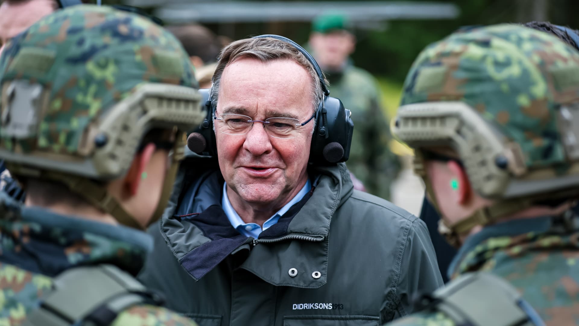 German Defence Minister Boris Pistorius speaks with soldiers of the Bundeswehr Panzergrenadierbataillon 122 armoured infantry battalion during a live-fire exercise prior to the unit's deployment to Poland and then Lithuania on February 28, 2024 in Weiden, Germany. 