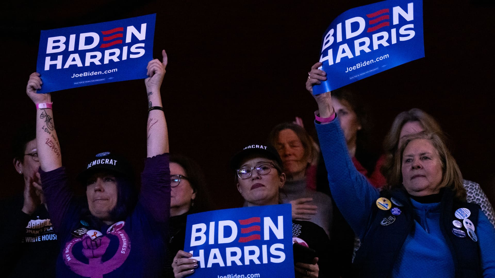 Attendees hold signs during a reproductive freedom campaign rally with US President Joe Biden and Vice President Kamala Harris, not pictured, at George Mason University in Manassas, Virginia, US, on Tuesday, Jan. 23, 2024. 