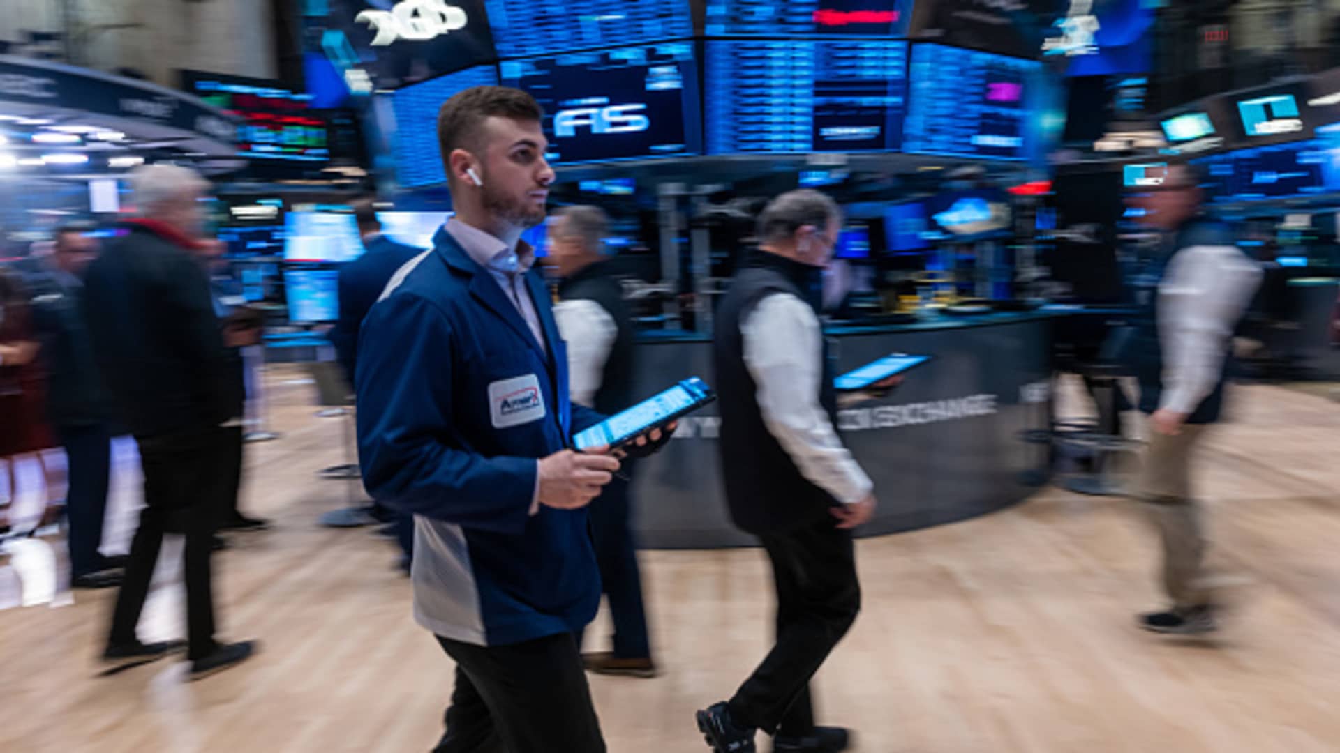 Traders work on the floor during morning trading at the New York Stock Exchange on March 6, 2024.