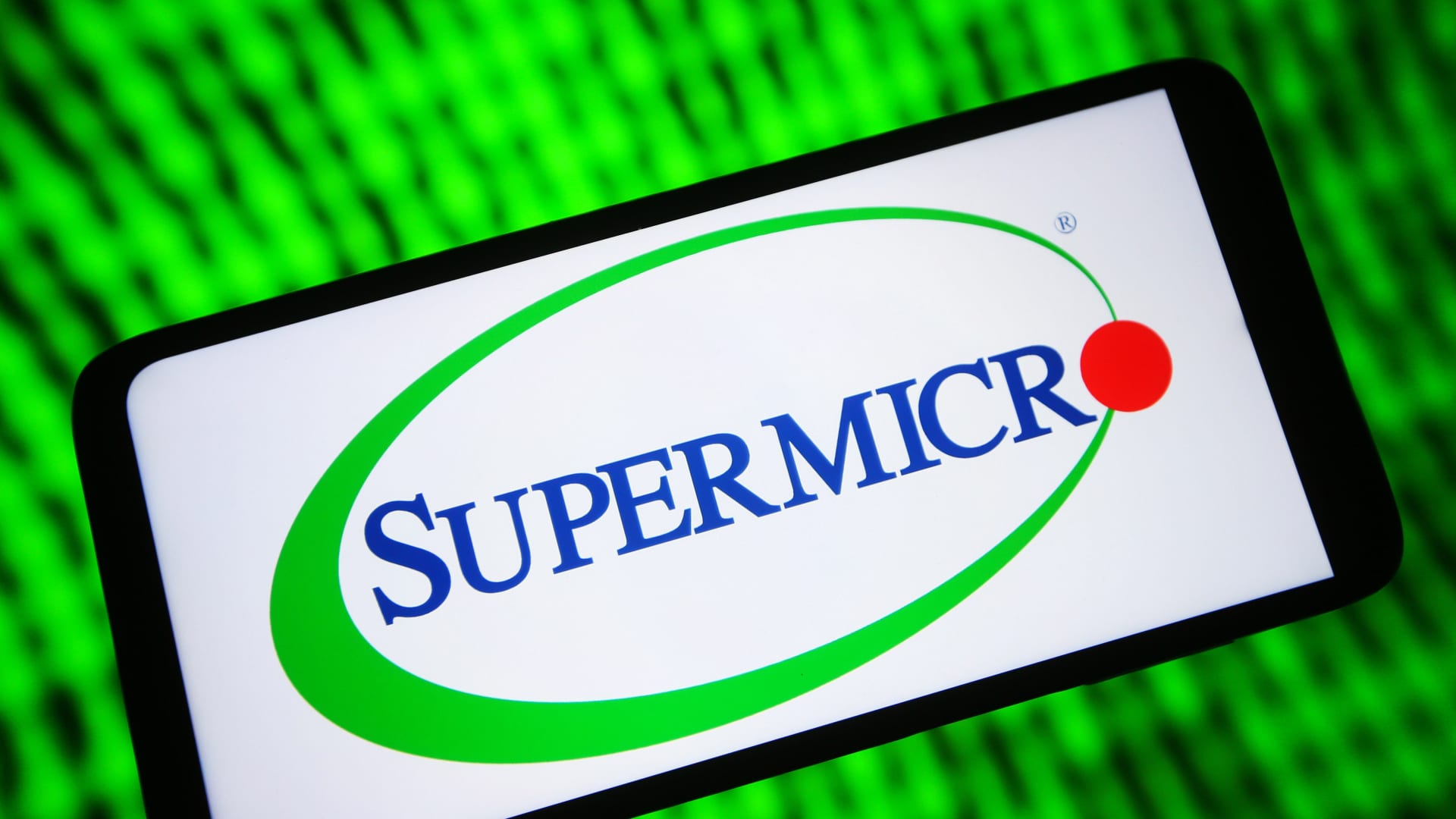 The Super Micro Computer logo is seen on a smartphone screen.