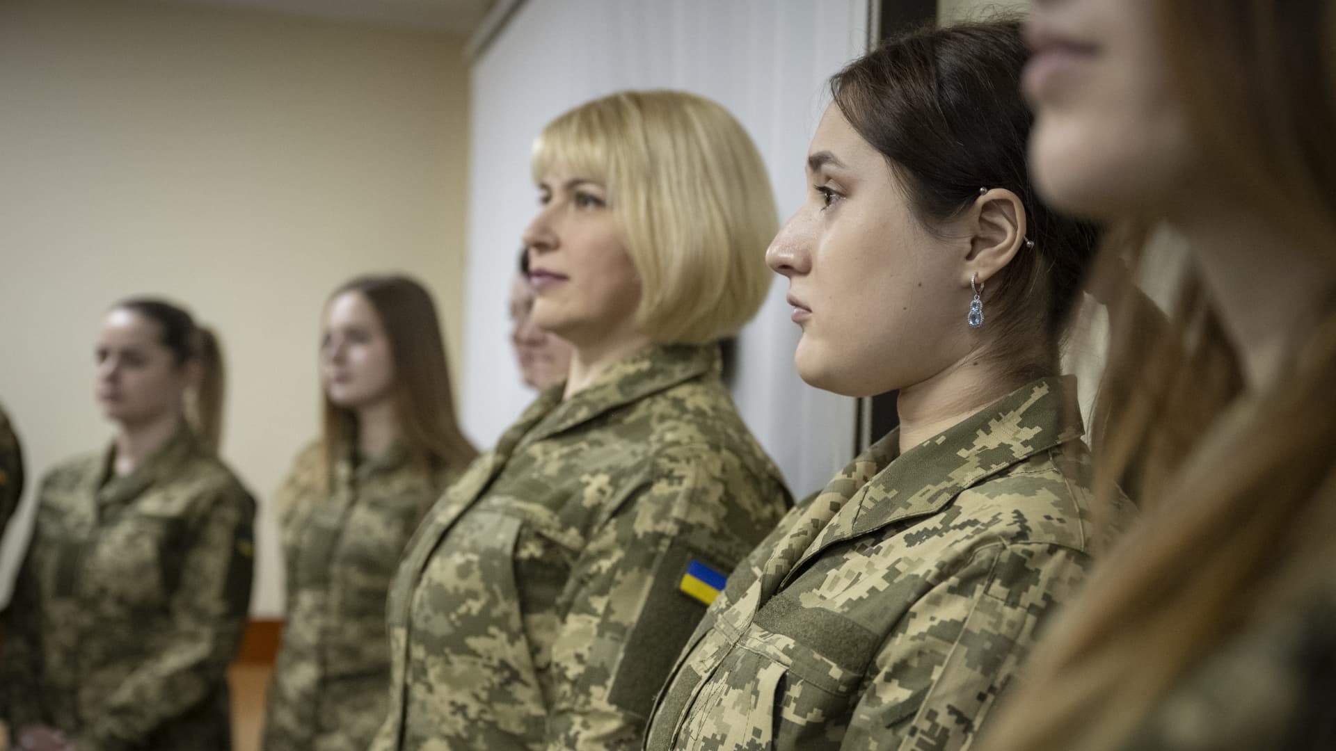 Women in military uniforms pose for a photo during the presentation on February 1, 2024 in Kyiv, Ukraine. The Ministry of Defense of Ukraine has held a presentation of military uniforms for women with 50,000 sets produced in Ukraine.