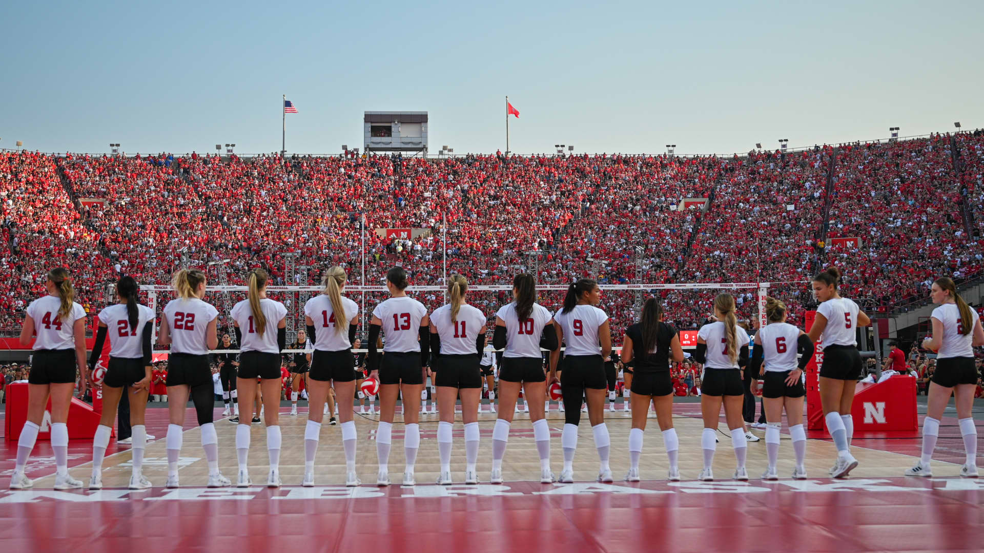 The Nebraska Cornhuskers stand on the court during introductions before the match against the Omaha Mavericks at Memorial Stadium on August 30, 2023 in Lincoln, Nebraska.