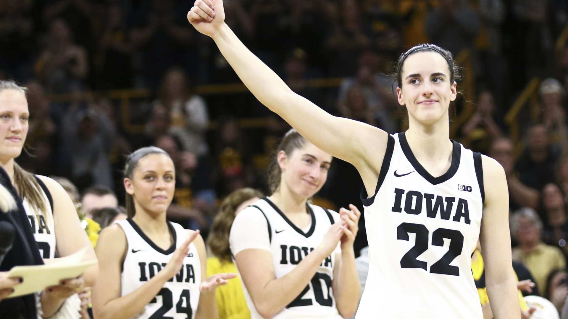 Caitlin Clark of the Iowa Hawkeyes waves to the crowd during senior day festivitiesafter the match-up against the Ohio State Buckeyes at Carver-Hawkeye Arena on March 3, 2024 in Iowa City, Iowa.