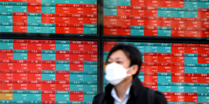 Japan markets slide; Australia shares rally to record high as miners rise 