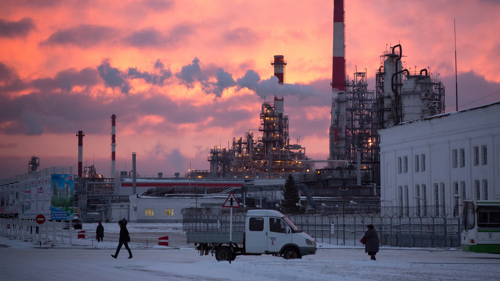 A red dawn illuminates cracking towers at the Lukoil-Nizhegorodnefteorgsintez (NORSI) oil refinery, operated by OAO Lukoil, in Nizhny Novgorod, Russia.