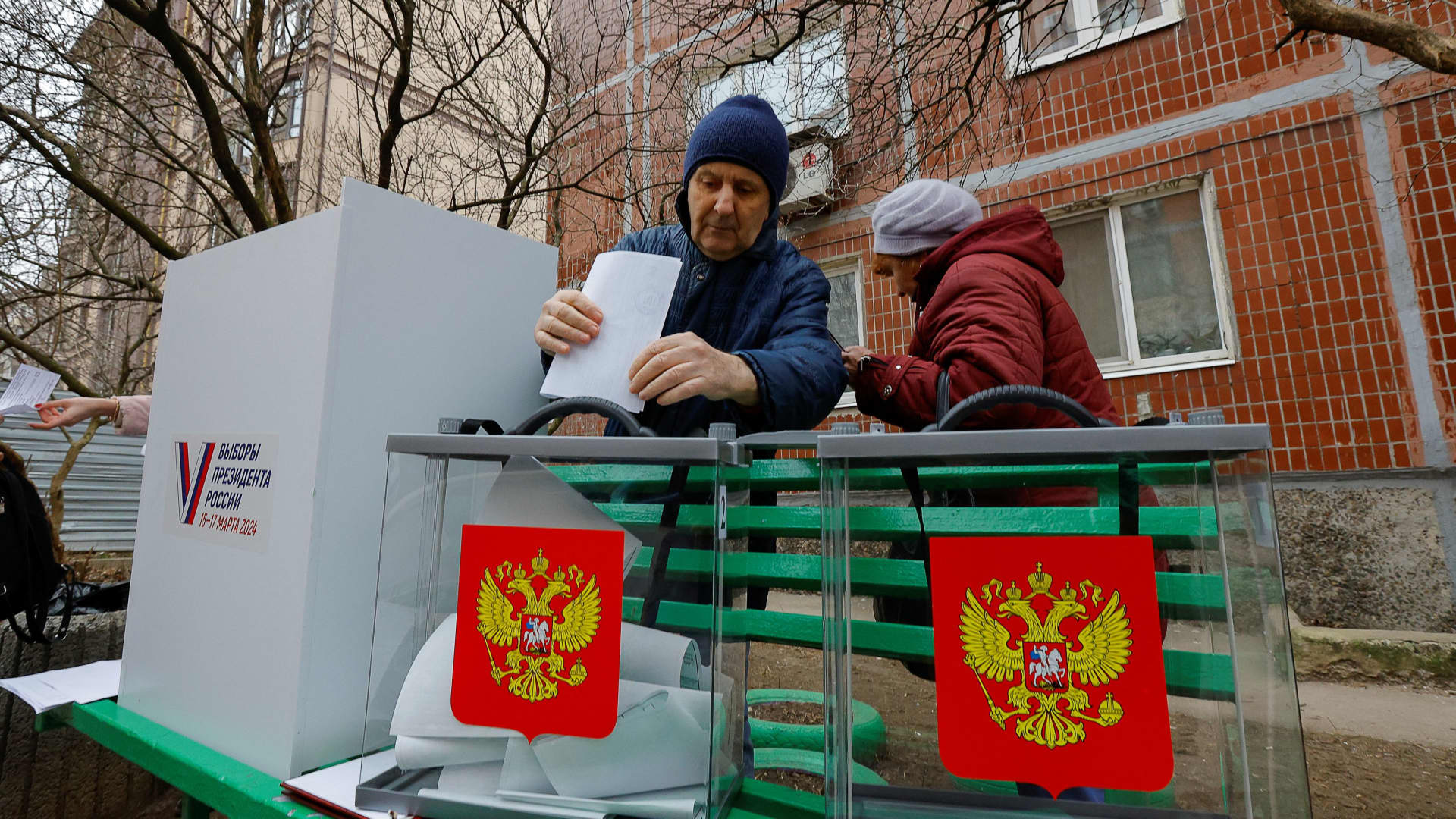 People visit a mobile polling station during the early voting in Russia’s presidential election, in the course of Russia-Ukraine conflict in Donetsk, Russian-controlled Ukraine, March 10, 2024. 