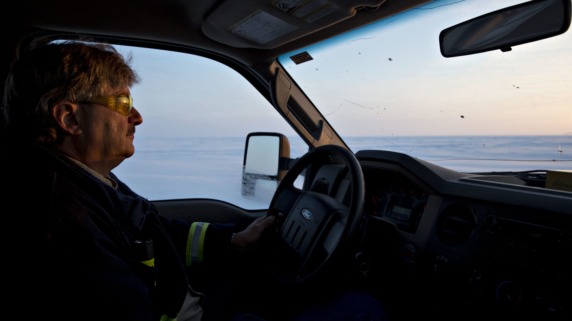 An employee drives a truck on an ice road near the Caelus Energy LLC Oooguruk Development Project in Harrison Bay, Alaska, U.S., on Friday, Feb. 17, 2017. 