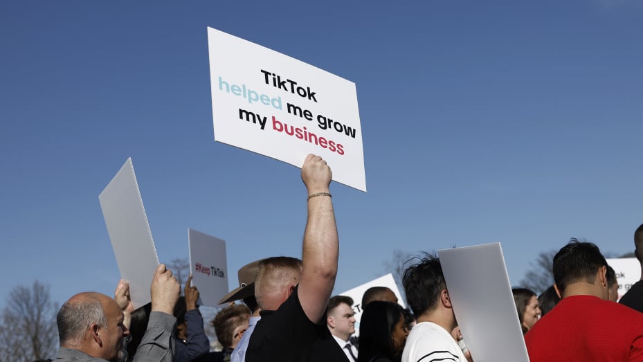 WASHINGTON, DC - MARCH 12: Participants hold signs in support of TikTok at a news conference outside the U.S. Capitol Building on March 12, 2024 in Washington, DC. House Democrats and TikTok creators and business owners held the news conference to express their concern over House Republicans legislation that would force the owners of the popular Chinese social media app to sell the platform or face a ban in the United States. (Photo by Anna Moneymaker/Getty Images)