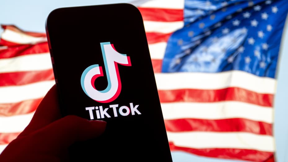 ANKARA, TURKIYE - MARCH 12: In this photo illustration logo of TikTok and U.S. flag are displayed in Ankara, Turkiye on March 12, 2024. (Photo by Omer Taha Cetin/Anadolu via Getty Images)