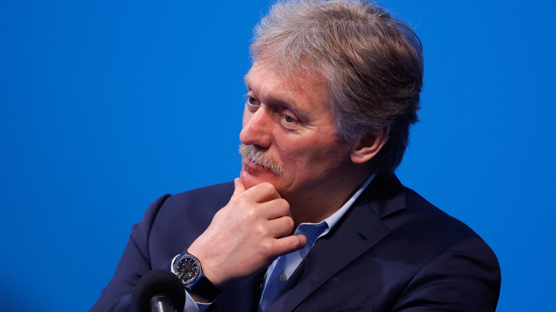 Kremlin spokesman Dmitry Peskov listens as Russian presidential candidate and incumbent President Vladimir Putin (not pictured) speaks after polling stations closed, in Moscow, Russia, March 18, 2024. 