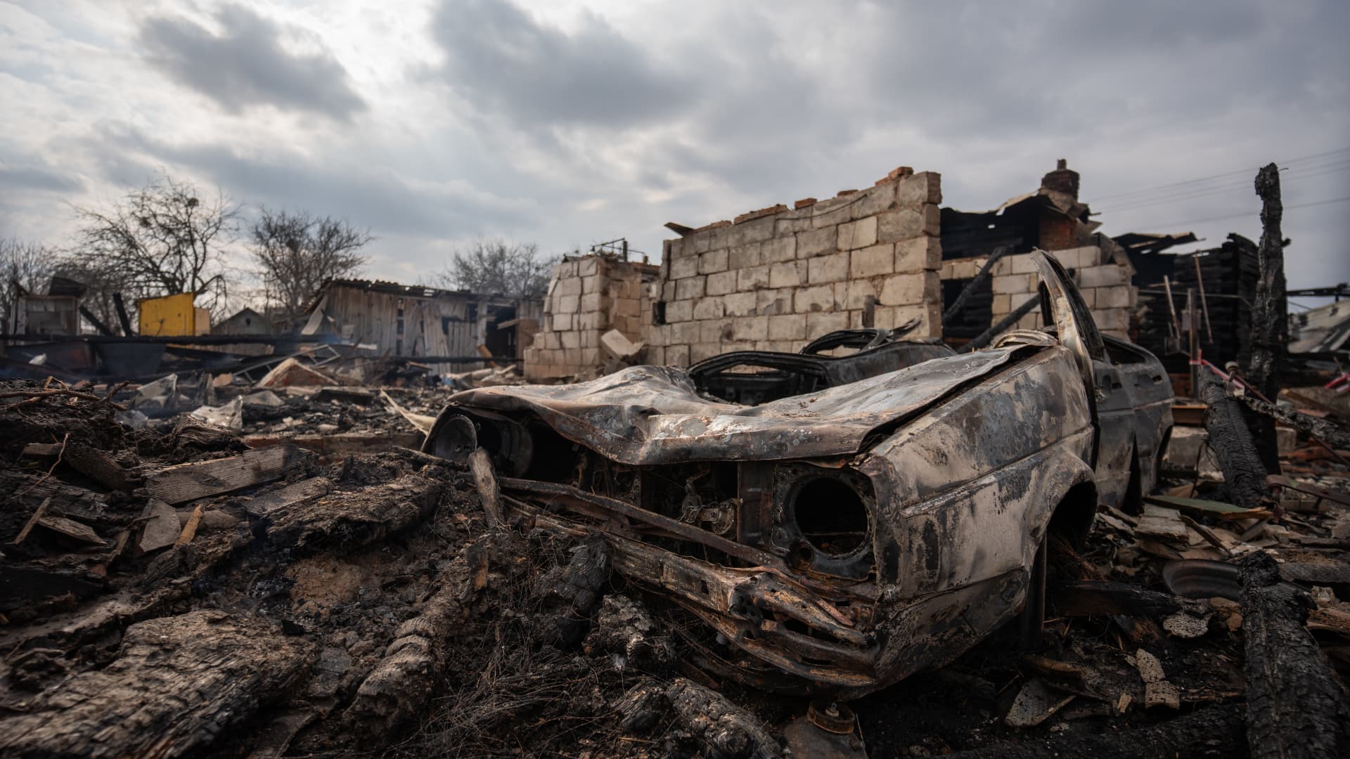 The wreckage of a car is seen amid rubble and debris at a house of the Kriazh family destroyed by Russian shelling on March 17, 2024 in Makyshyn, Chernihiv Oblast, Ukraine.