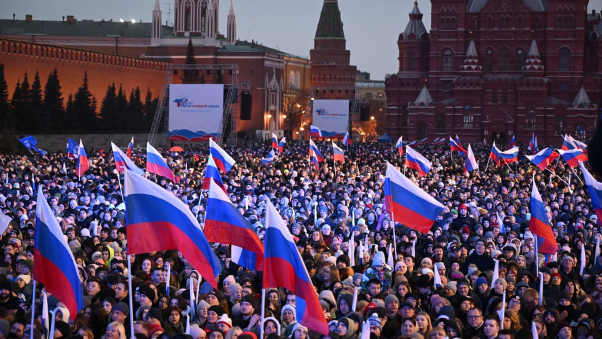 People attend a rally and a concert celebrating the 10th anniversary of Russia's annexation of Crimea at Red Square in Moscow on March 18, 2024. 