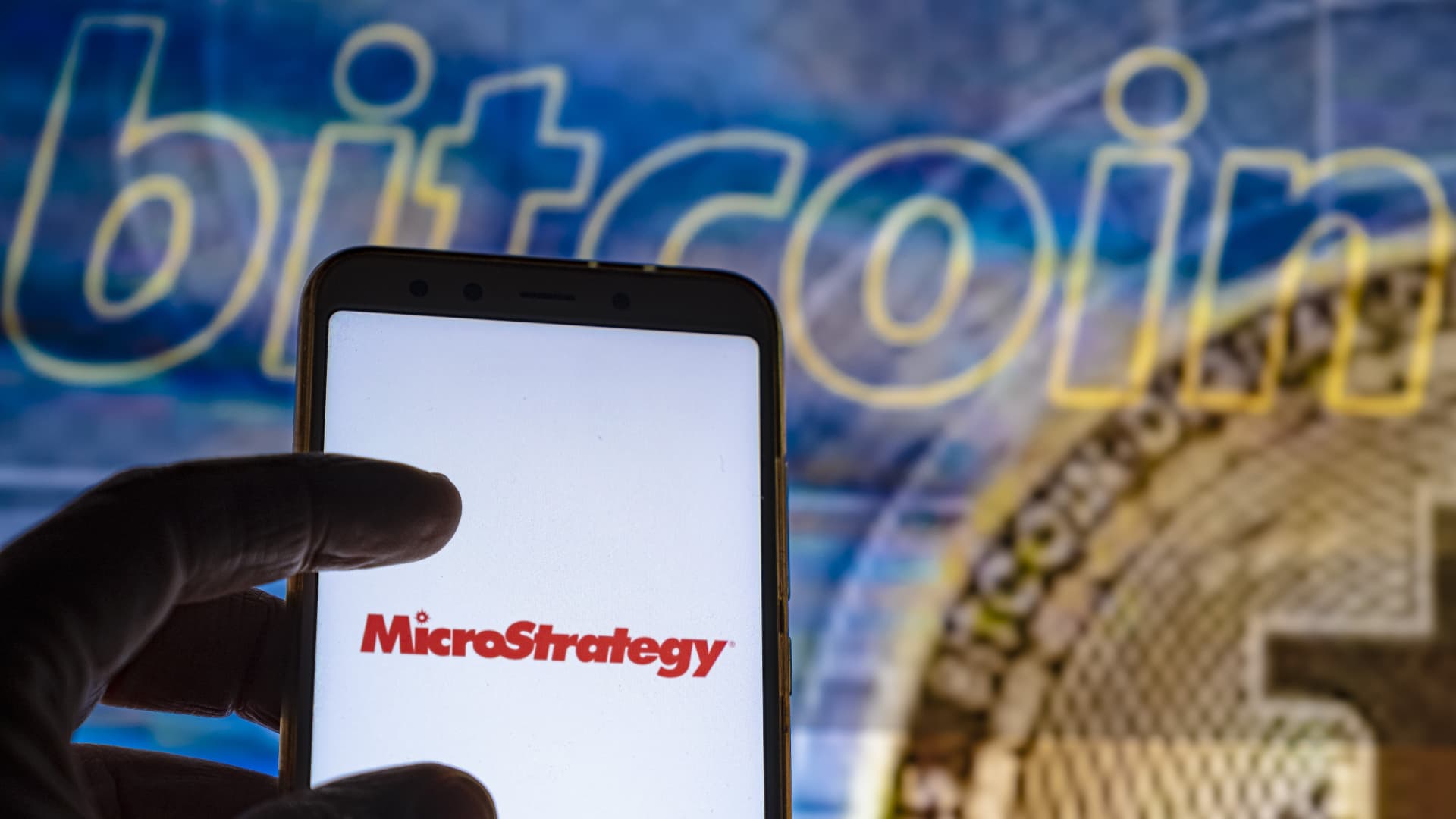 MicroStrategy, largest corporate holder of bitcoin, drops as much as 18% as cryptocurrency falls