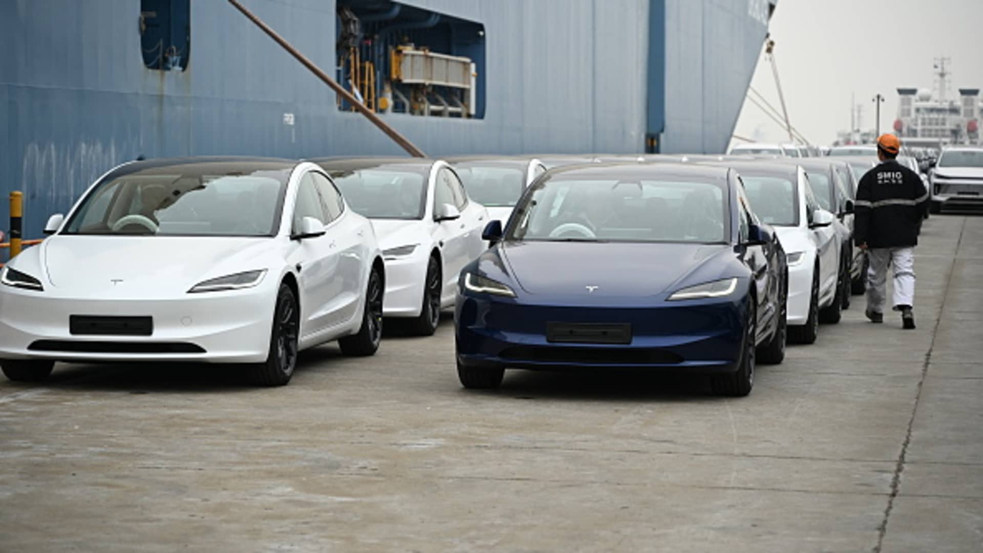 Tesla's new Model 3 sedans wait to be shipped aboard at Shanghai Haitong International Automotive Terminal in Shanghai, China, on March 14, 2024.