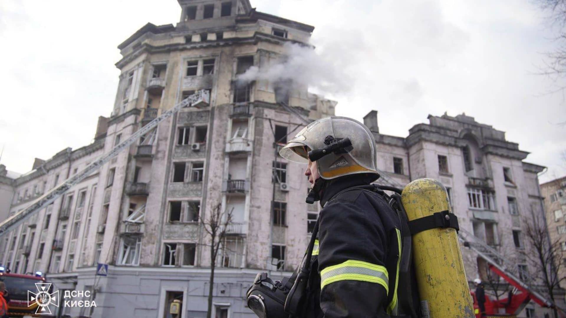 Firefighters try to extinguish the fire after a fire broke out residential buildings and conduct search and rescue operations after Russian attacks in Kyiv, Ukraine on March 21, 2024. 