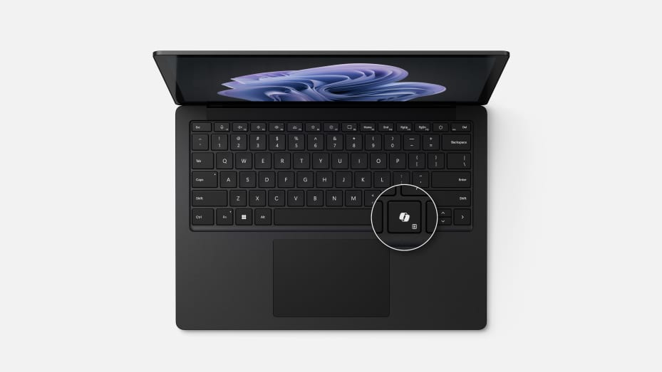 The Copilot key on the Microsoft Surface Laptop 6 for Business appears to the left of the arrow keys.
