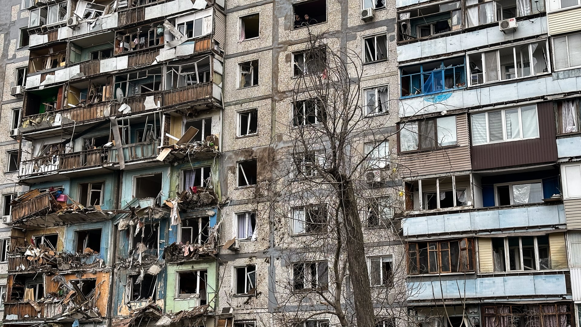 A 9-story residential building in the Dniprovskyi district stands with partially destroyed balconies and broken windows following a Russian missile strike on March 22, 2024 in Zaporizhzhia, Ukraine.