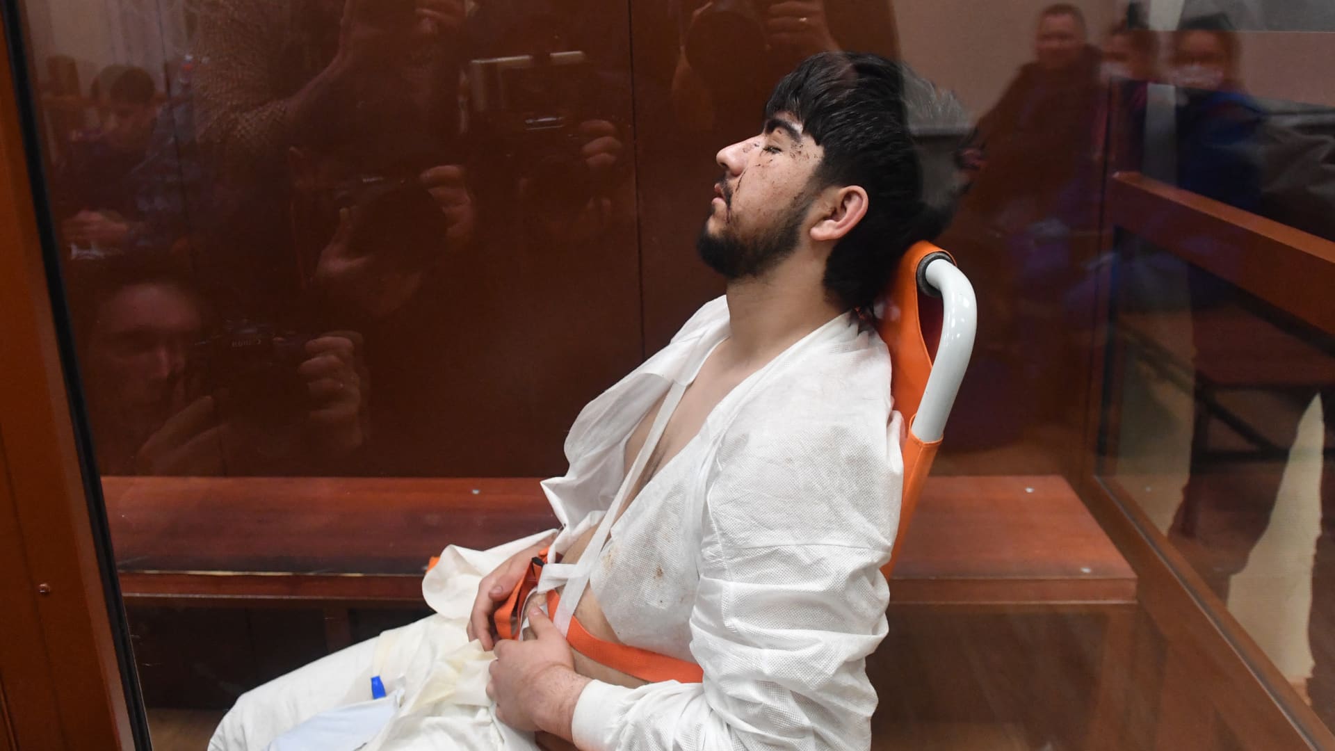 A man suspected of taking part in the attack of a concert hall that killed 137 people, the deadliest attack in Europe to have been claimed by the Islamic State jihadist group, sits inside the defendant cage as he waits for his pre-trial detention hearing at the Basmanny District Court in Moscow on March 25, 2024. 