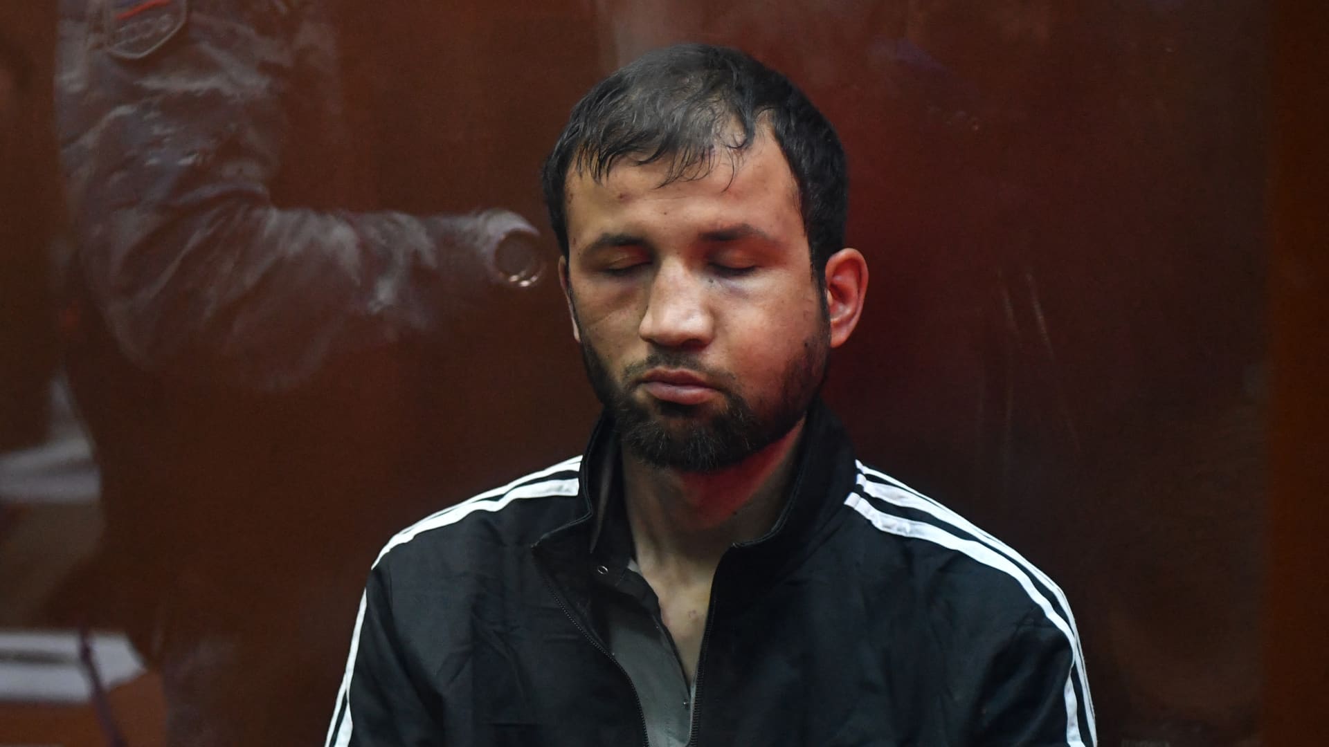 A man suspected of taking part in the Crocus City Hall attack waits for his pre-trial detention hearing at the Basmanny District Court in Moscow on March 24, 2024. 