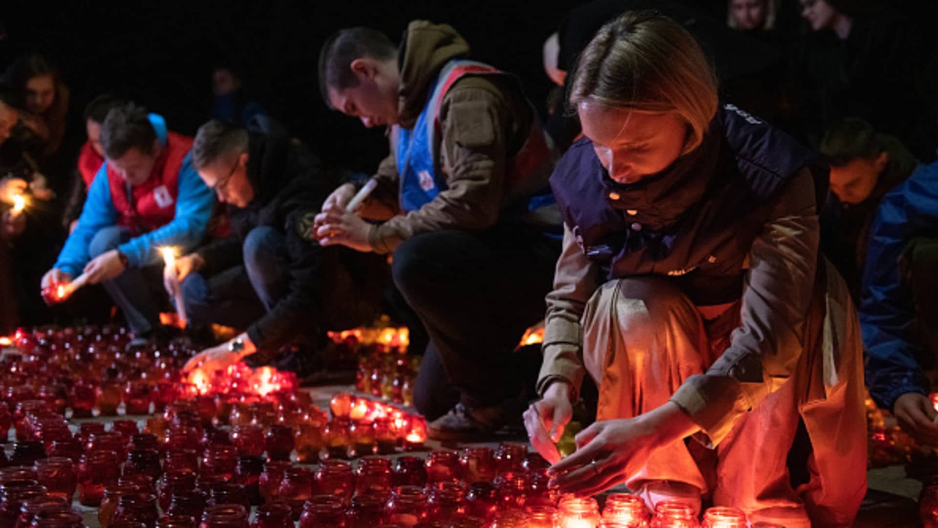 People light candles during a memorial gathering in Donetsk, Russian-controlled Ukraine, on March 24, 2024, as Russia observes a national day of mourning after a Moscow concert hall massacre that killed more than 130 people.