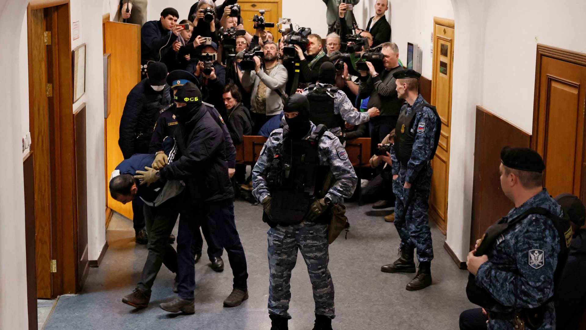 Saidakrami Murodali Rachabalizoda, a suspect in the shooting attack at the Crocus City Hall concert venue, is escorted after a court hearing at the Basmanny district court in Moscow, Russia March 24, 2024. 