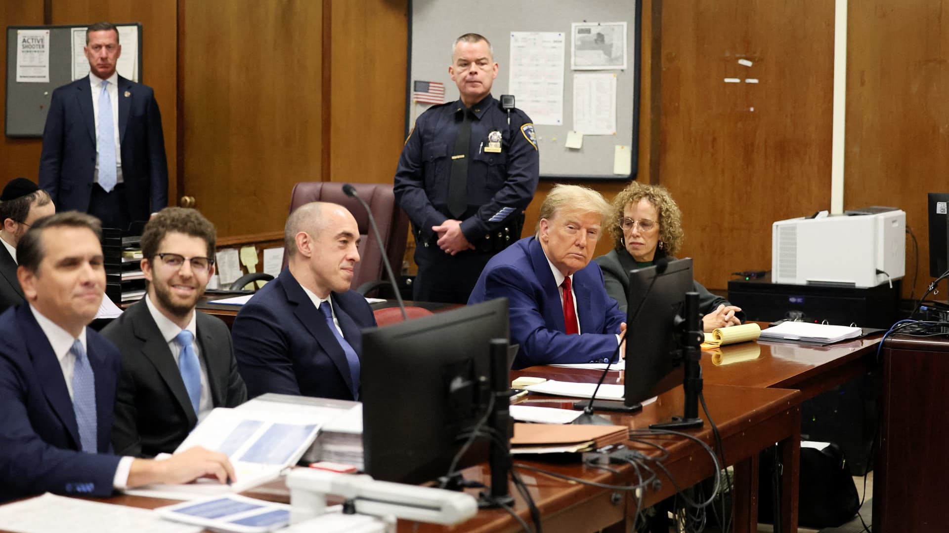 Former U.S. President Donald Trump sits with his lawyer Susan Necheles, in the courtroom at a hearing in his criminal case on charges stemming from hush money paid to a porn star in New York City, U.S., March 25, 2024. 