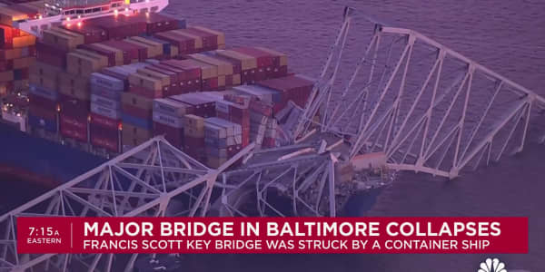 Major bridge in Baltimore collapses after being struck by container ship, people in water
