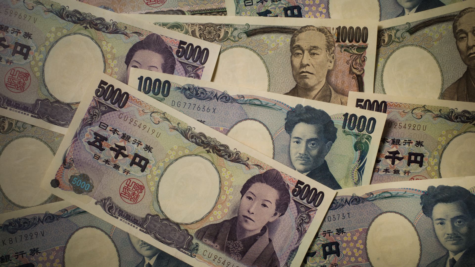 Japanese 1,000 yen, 5,000 yen and 10,000 yen banknotes arranged in Kyoto, Japan.
