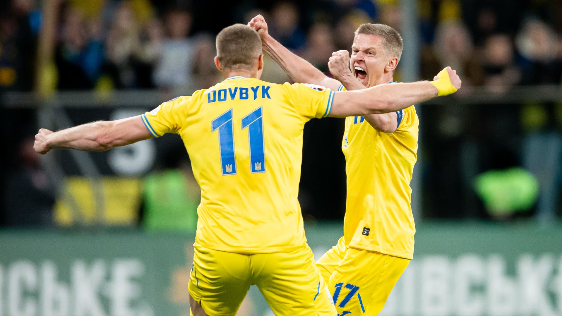 Oleksandr Zinchenko and Artem Dovbyk of Ukraine celebrate after winning the UEFA EURO 2024 play-offs final match with Iceland at the Tarczynski Arena on March 26, 2024, in Wroclaw, Poland.