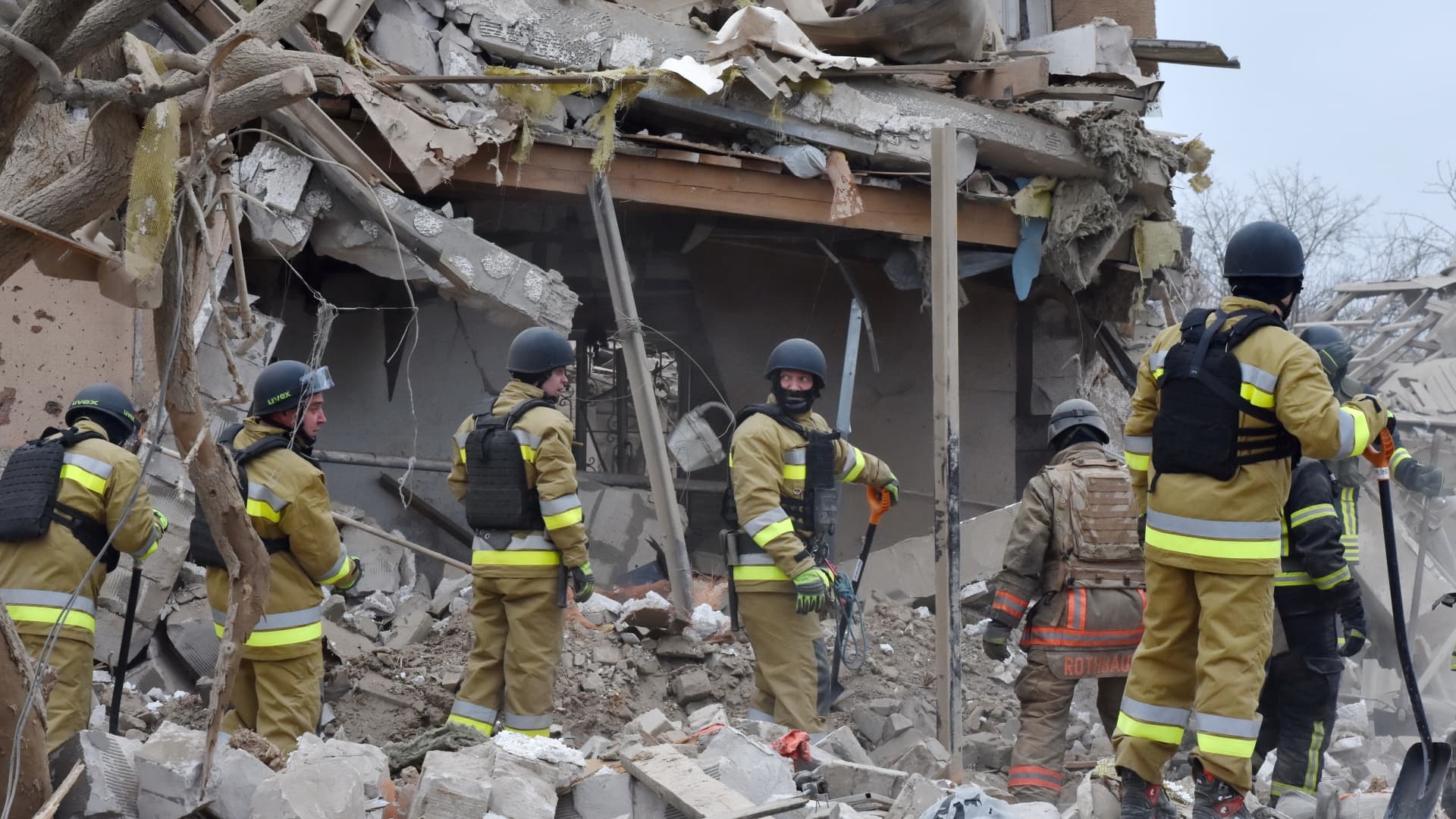 Ukrainian State Emergency Service firefighters seen during the inspection of a destroyed private house following a Russian missile attack in Zaporizhzhia on March 22, 2024.