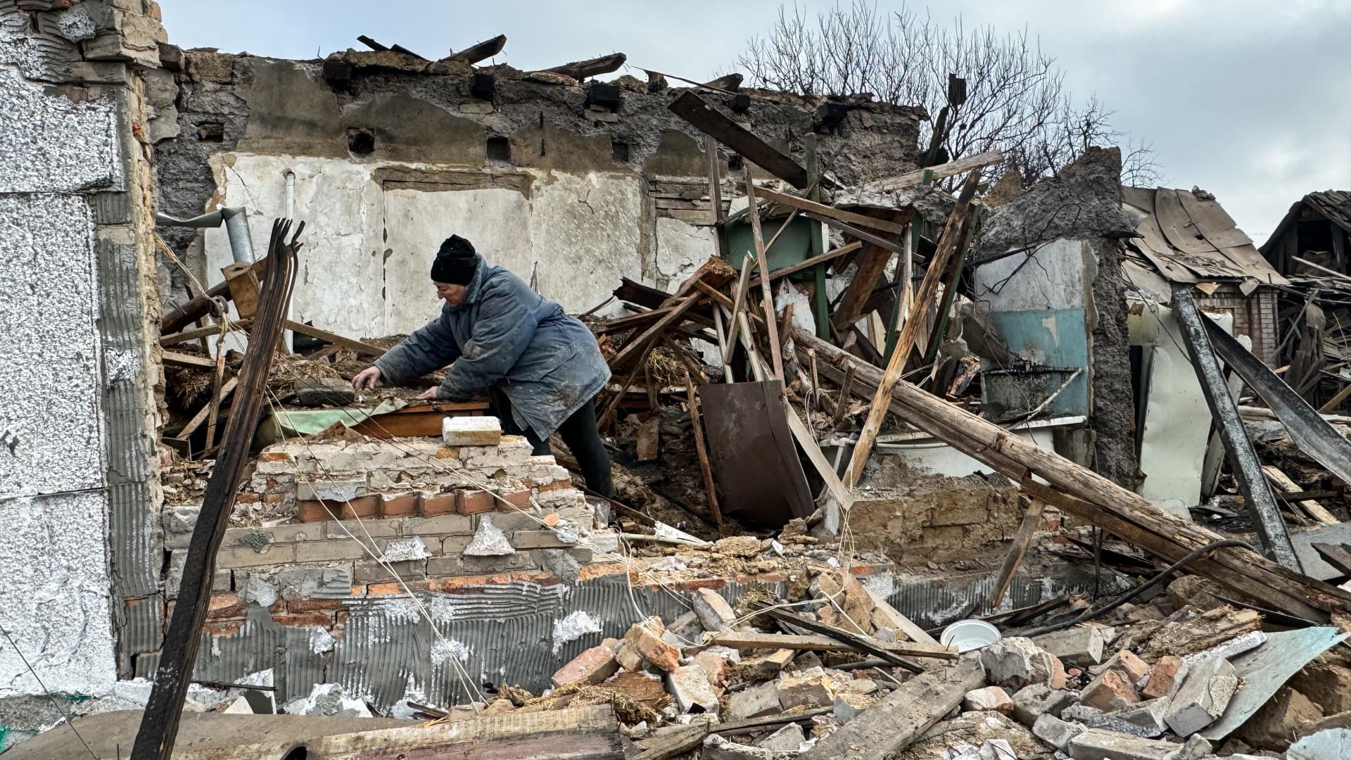 A woman removes the rubble of a destroyed private home after a Russian drone attack on March 28, 2024 in Zaporizhzhia, Ukraine.