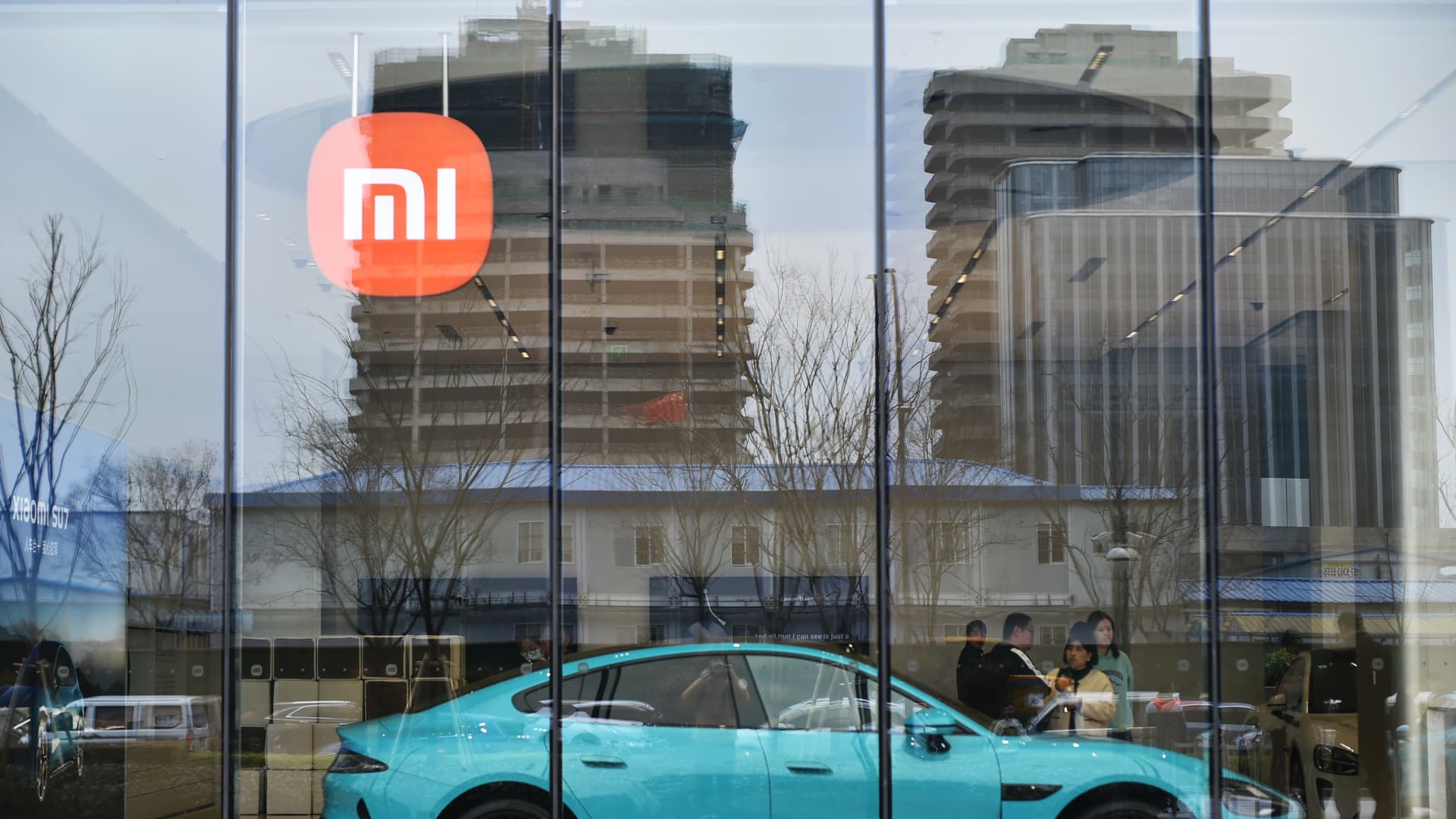Xiaomi shares pop 15% after the Chinese smartphone maker launches first EV