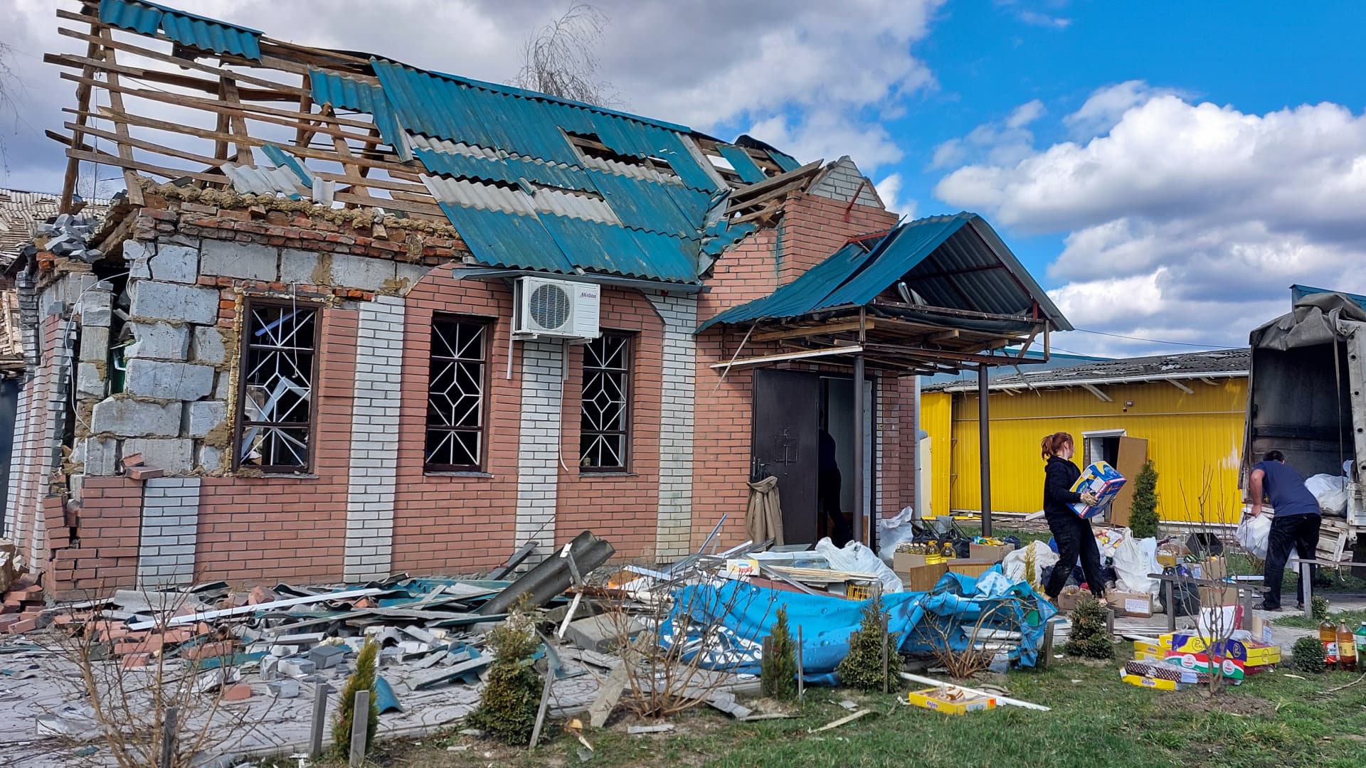 People load survived food from a damaged store in truck after Russian shelling on April 3, 2024 in Sumy Oblast, Ukraine. A man died in the Krasnopillia community due to shelling by Russian army. twenty houses, a school, kindergarten, village council and a dispensary were also damaged. 