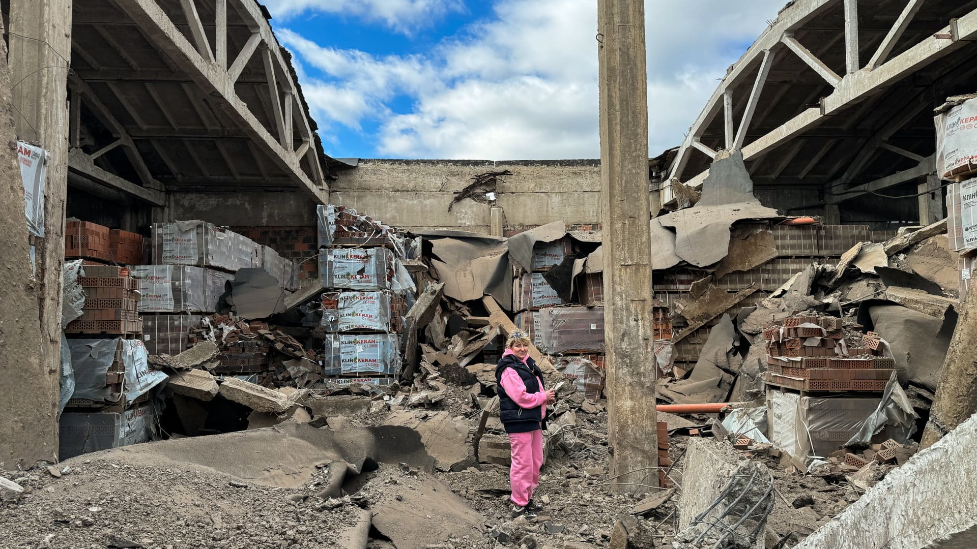 An employee of enterprise stands amid ruins of warehouse with product after night Russian air attack on April 3, 2024 in Sumy Oblast, Ukraine.