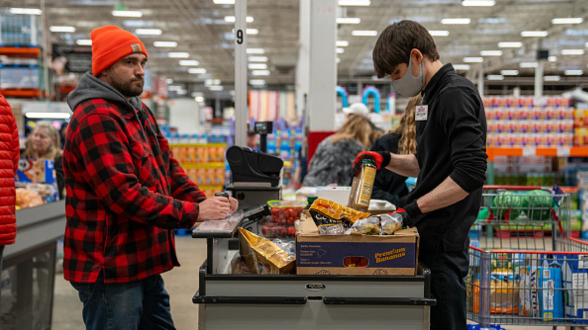 A customer moves through the check out lane with his groceries at a Costco Wholesale store on April 3, 2024 in Colchester, Vermont. 