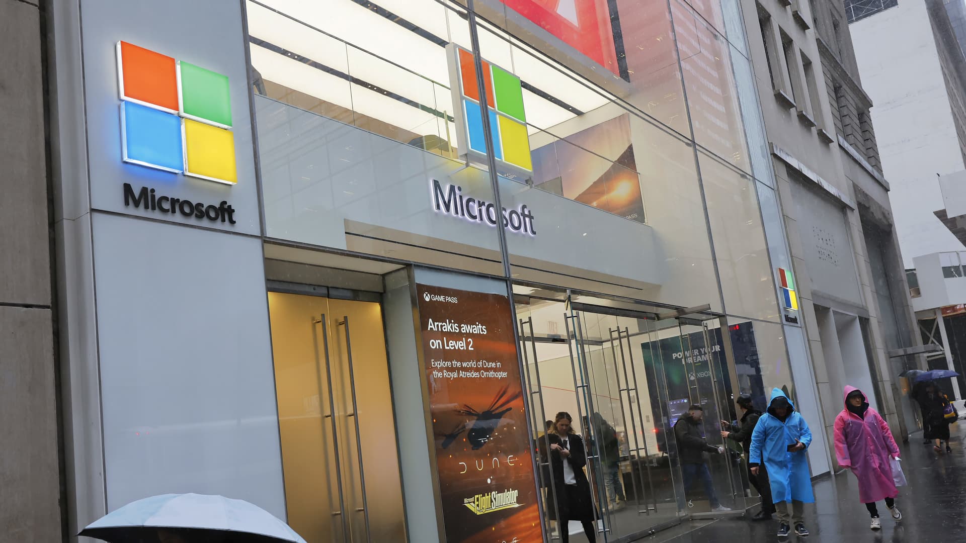 People walk past a Microsoft Experience Center on Fifth Avenue in New York City on April 3, 2024.