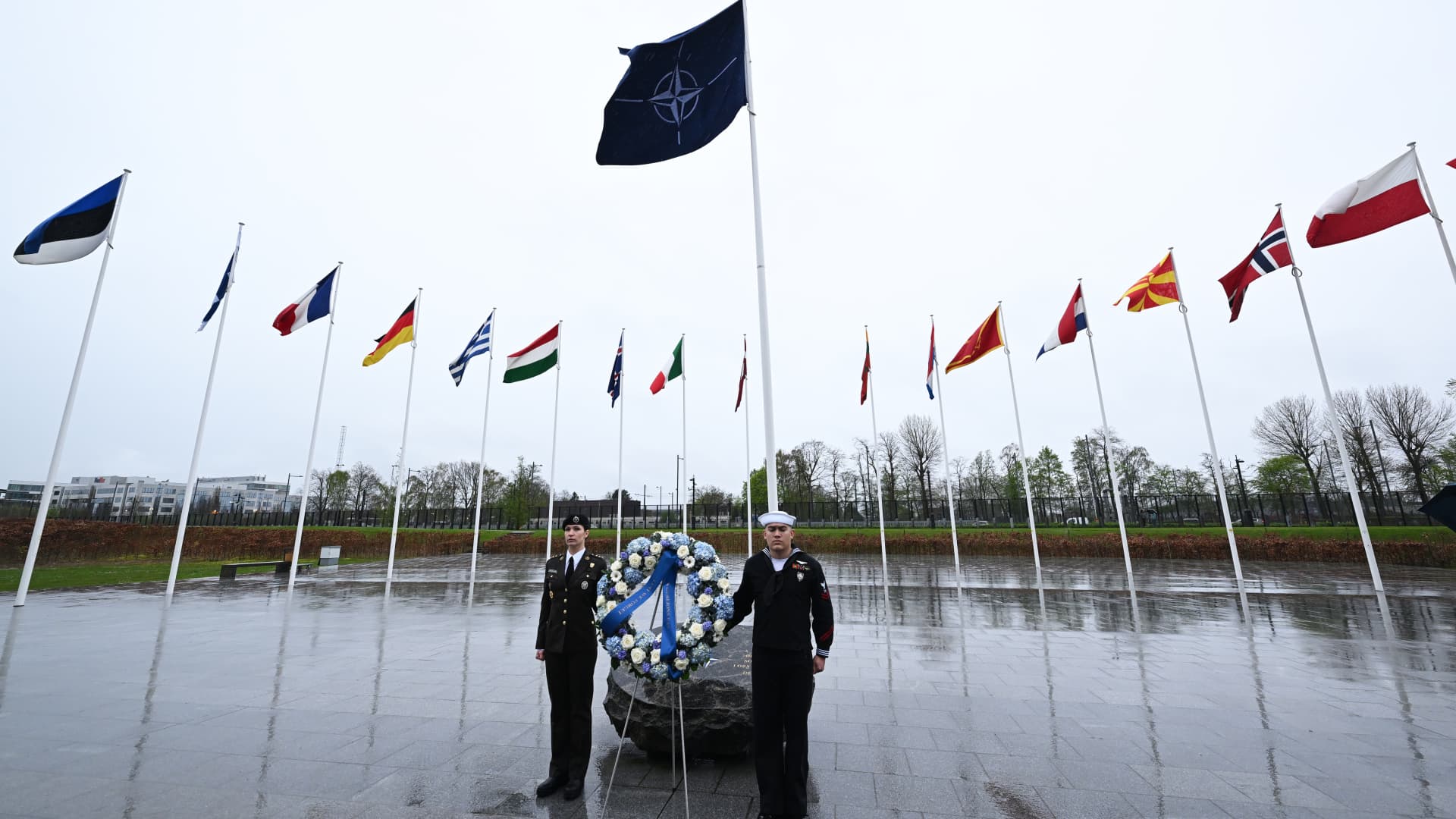 Soldiers hold a wreath during NATO's 75th anniversary ceremony, held in the gathering place called 'Agora' at the NATO headquarters in Brussels, Belgium on April 4, 2024. 