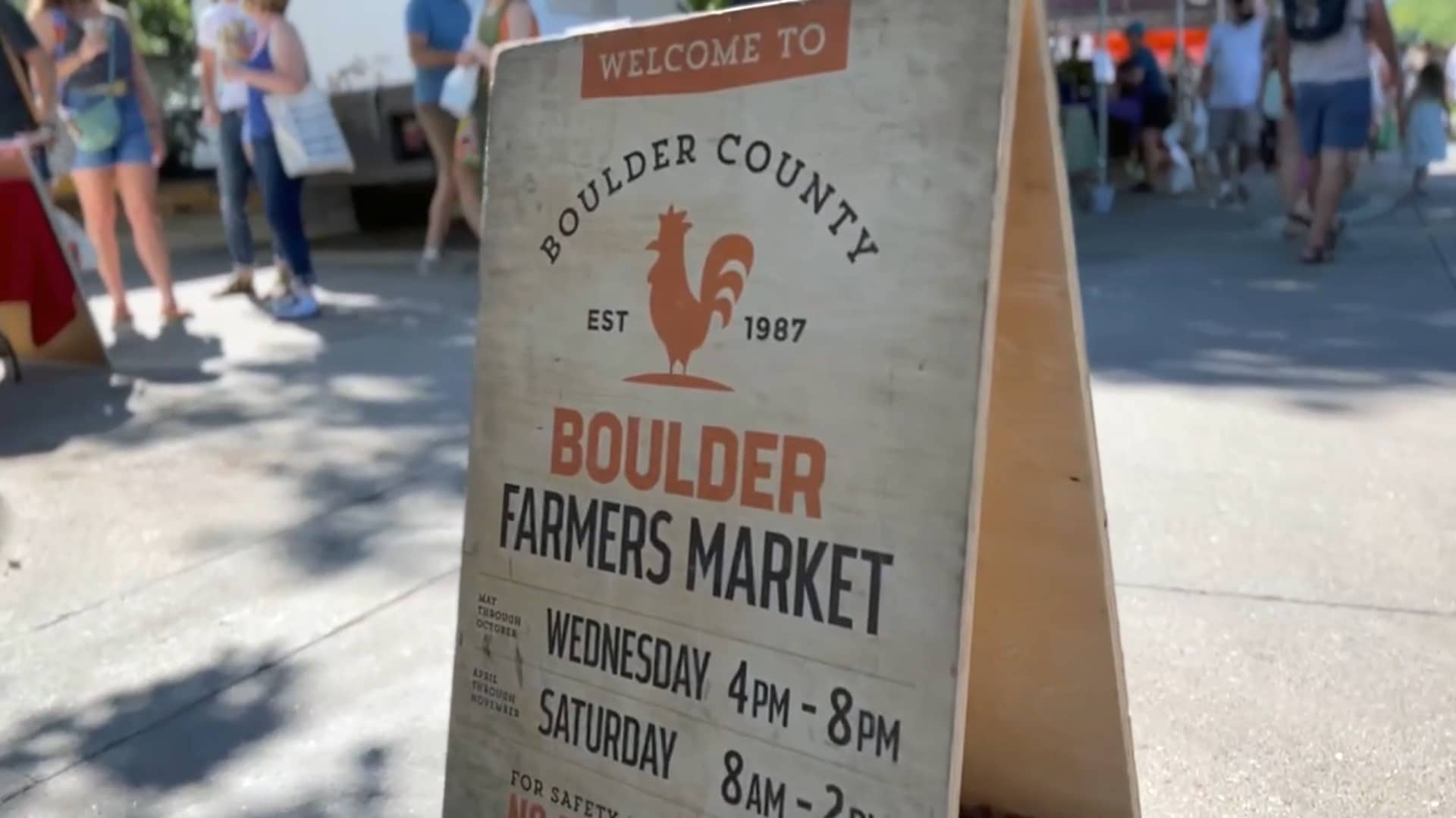 A sign from the Boulder Farmers Market, operating from April to November, serving as an incubator for numerous small food businesses.