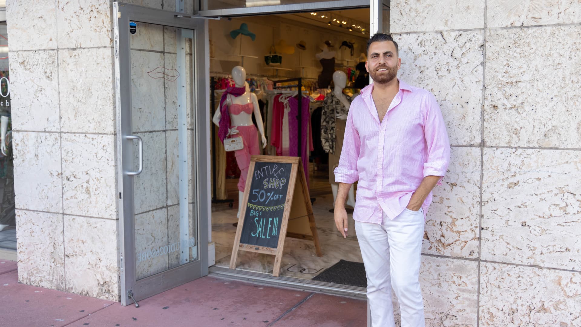 Daniel Habibian stands outside his store, Studio 26, a clothing boutique in South Beach.