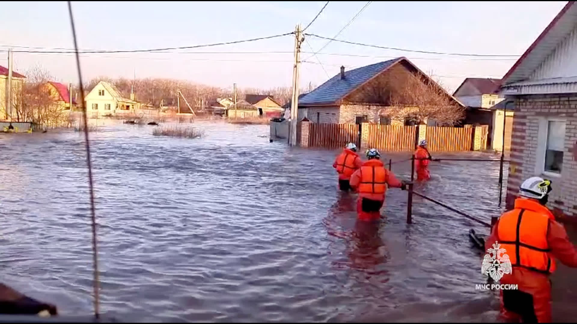 A screen grab captured from a video shows teams continuing to conduct an evacuation works for residents due to flooding after a dam burst in the city of Orsk, Russia on April 6, 2024.