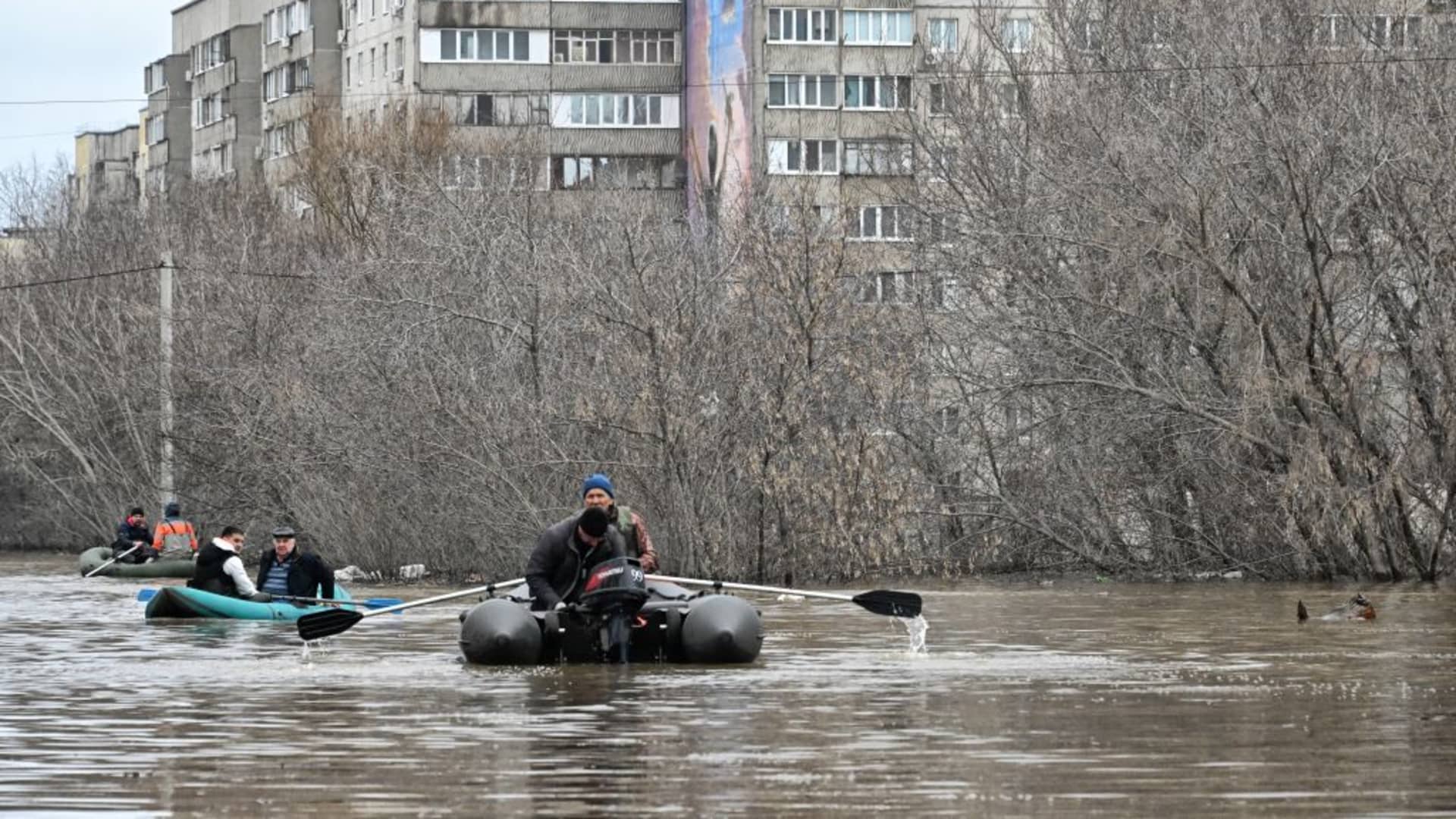 A picture taken on April 8, 2024 shows rescuers evacuating residents from the flooded part of the city of Orsk, Russia's Orenburg region, southeast of the southern tip of the Ural Mountains.