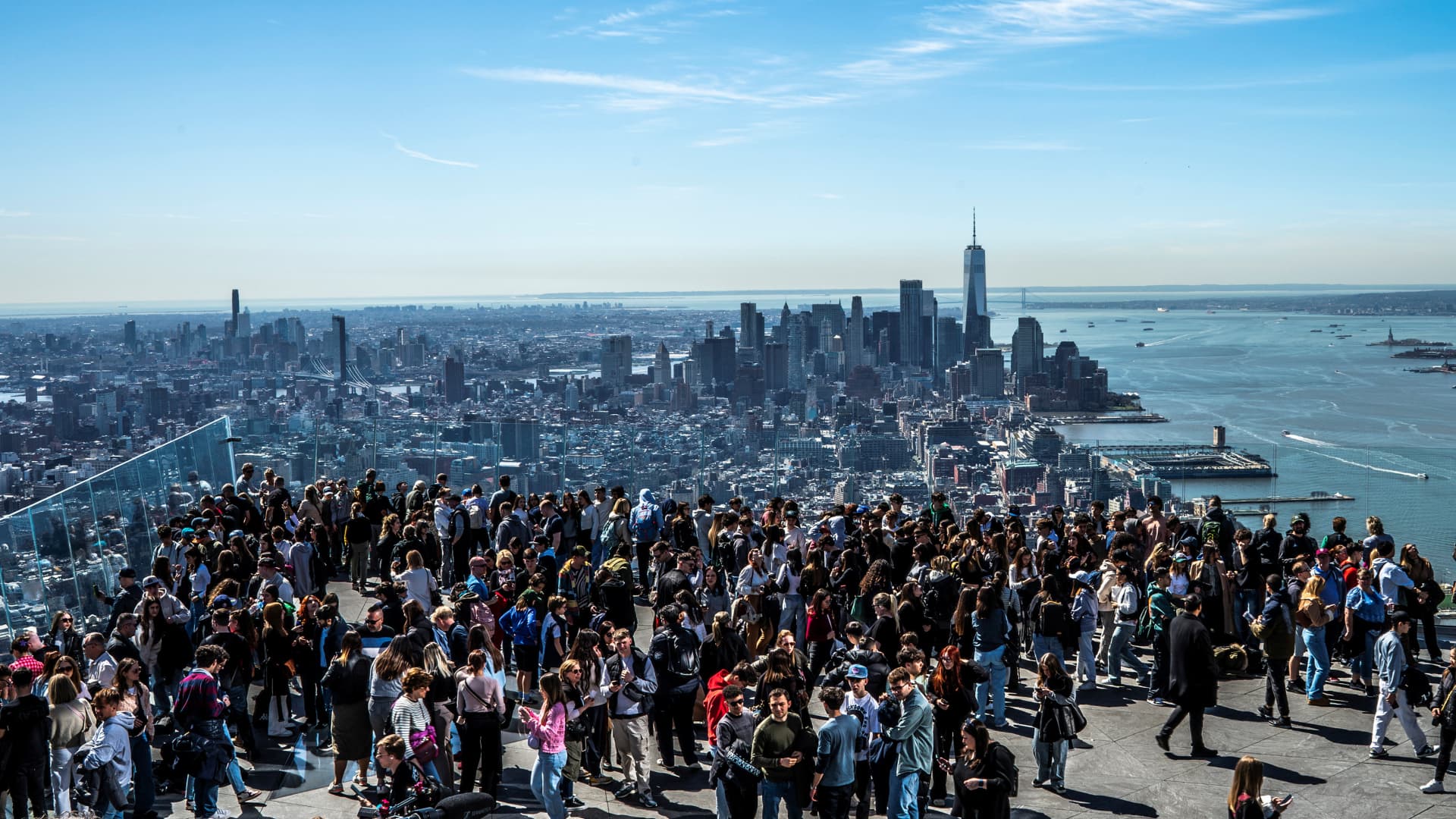 People gather on the observation deck of Edge at Hudson Yards before a partial solar eclipse in New York City, New York, U.S., April 8, 2024. 
