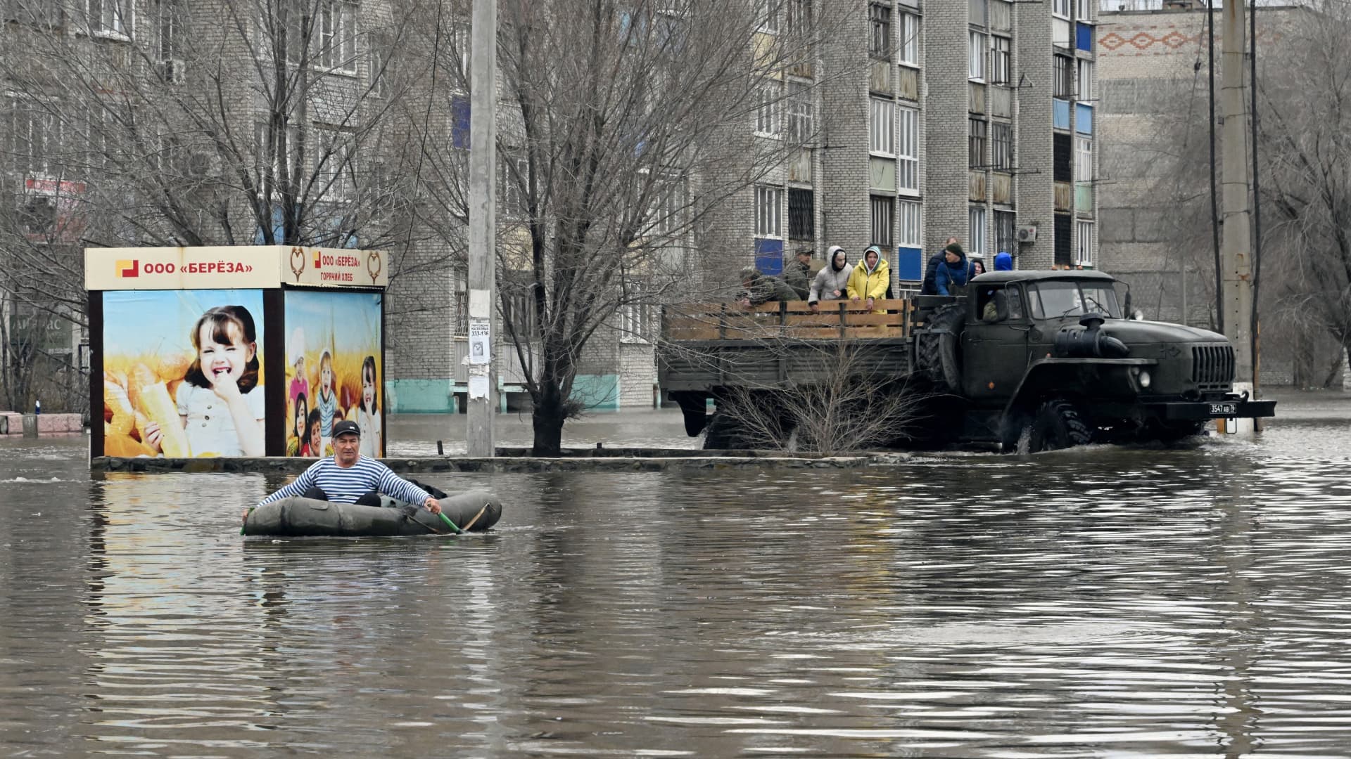A picture taken on April 8, 2024 shows rescuers evacuating residents from the flooded part of the city of Orsk, Russia's Orenburg region, southeast of the southern tip of the Ural Mountains.