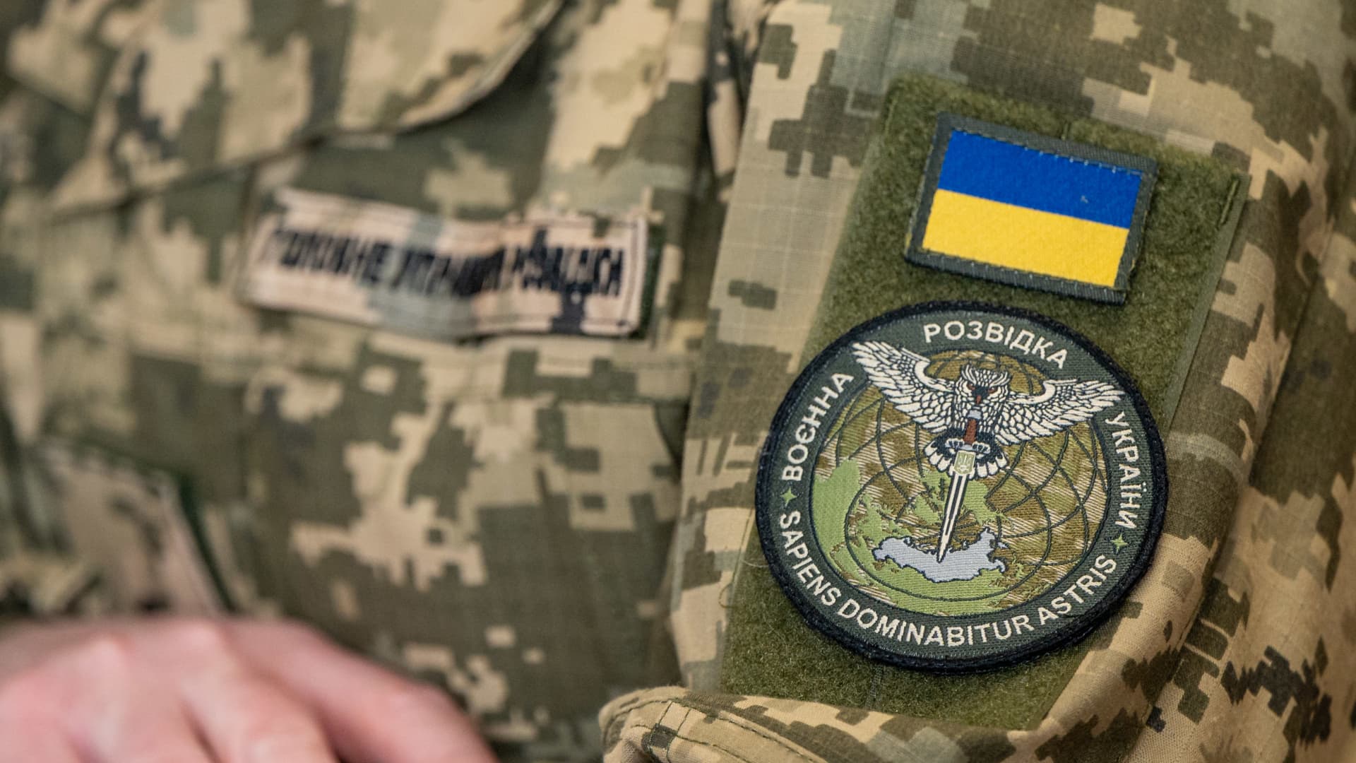 The chevron of Ukraine's main intelligence directorate is seen on the sleeve of the press representative of the Main Directorate of Intelligence of the Ukrainian Ministry of Defense.