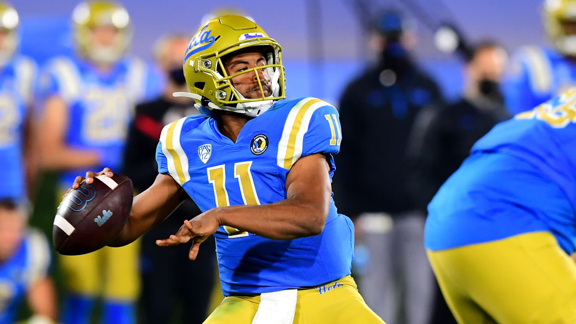Quarterback Chase Griffin #11 of the UCLA Bruins looks to pass the ball in the game against the Arizona Wildcats at the Rose Bowl on November 28, 2020 in Pasadena, California. 
