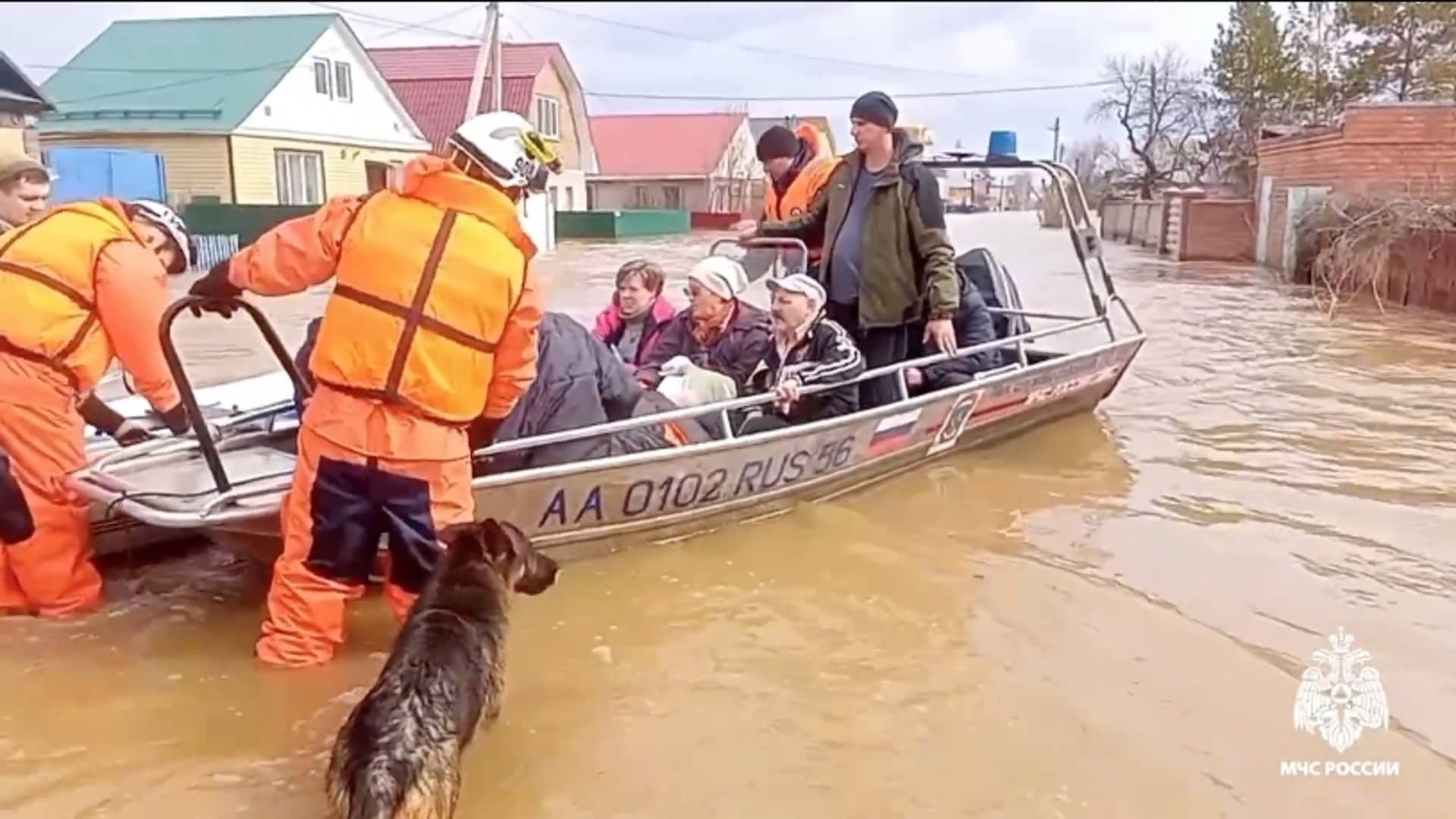 A screen grab captured from a video shows residents and pets are being evacuated collectively due to flooding after a dam burst in the city of Orsk, Russia on April 6, 2024.