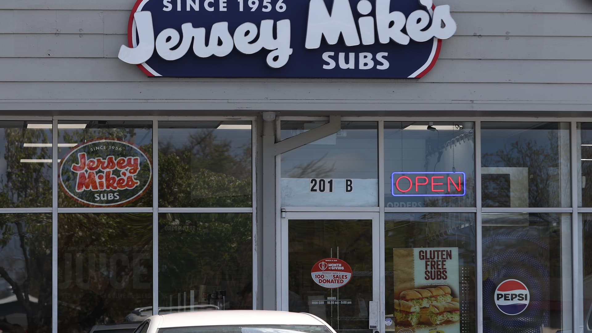 A sign is posted in front of a Jersey Mike's Subs shop on April 05, 2024 in Petaluma, California. 